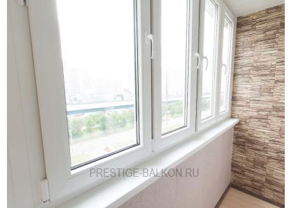 Тёплое остекление балкона профилем КВЕ и комбинированной отделкой пластиком и деревом в Жуковском